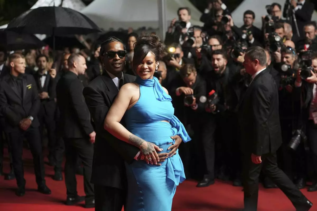 A$AP Rocky, left, and Rihanna pose for photographers upon departure from the premiere of the film 'Highest 2 Lowest' at the 78th international film festival, Cannes, southern France, Monday, May 19, 2025. (Photo by Lewis Joly/Invision/AP)