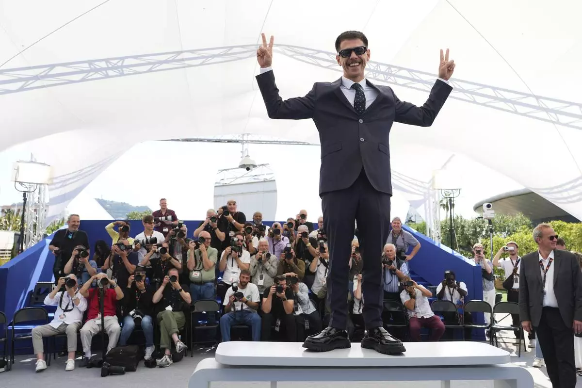 Nader Abd Alhay poses for photographers at the photo call for the film 'Once Upon a Time in Gaza' at the 78th international film festival, Cannes, southern France, Monday, May 19, 2025. (AP Photo/Natacha Pisarenko)