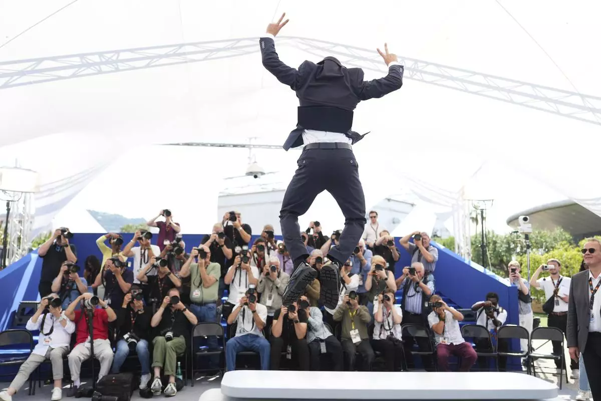 Nader Abd Alhay poses for photographers at the photo call for the film 'Once Upon a Time in Gaza' at the 78th international film festival, Cannes, southern France, Monday, May 19, 2025. (AP Photo/Natacha Pisarenko)