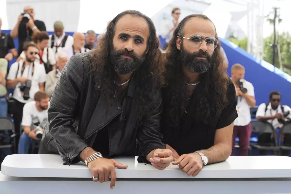 Director Arab Nasser, from left, and director Tarzan Abu Nasser pose for photographers at the photo call for the film 'Once Upon a Time in Gaza' at the 78th international film festival, Cannes, southern France, Monday, May 19, 2025. (AP Photo/Natacha Pisarenko)