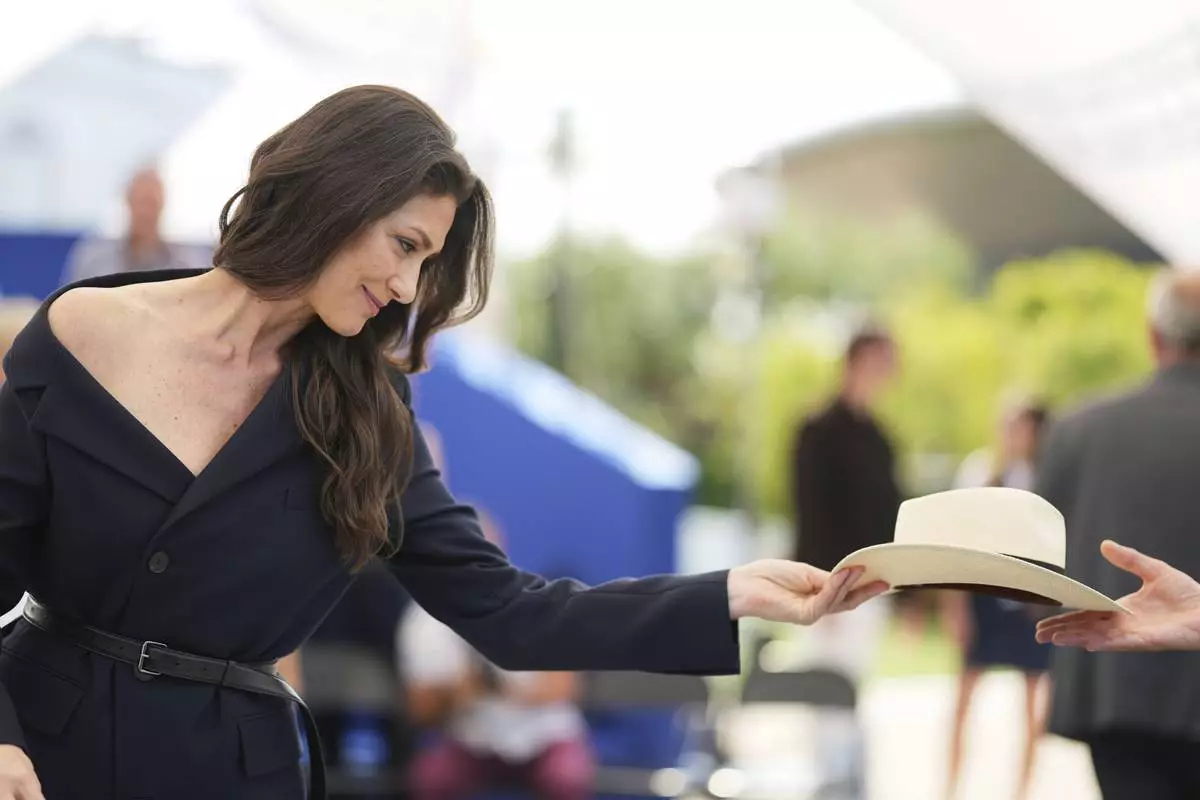 Maria Fernanda Candido poses for photographers at the photo call for the film 'The Secret Agent' at the 78th international film festival, Cannes, southern France, Monday, May 19, 2025. (AP Photo/Natacha Pisarenko)
