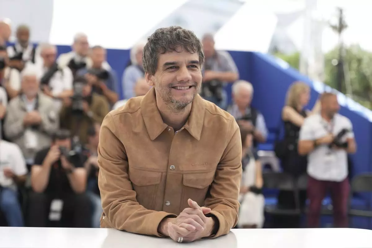 Wagner Moura poses for photographers at the photo call for the film 'The Secret Agent' at the 78th international film festival, Cannes, southern France, Monday, May 19, 2025. (AP Photo/Natacha Pisarenko)