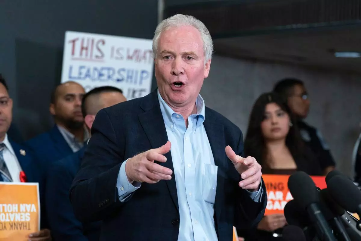 Sen. Chris Van Hollen, D-Md., during a news conference upon his arrival from meeting with Kilmar Abrego Garcia in El Salvador, at Washington Dulles International Airport, in Chantilly, Va., Friday, April 18, 2025. (AP Photo/Jose Luis Magana)
