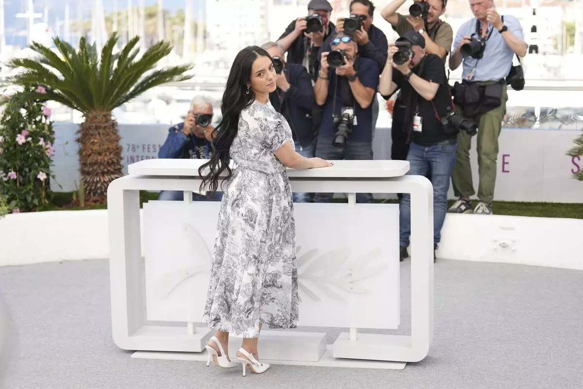 Director Hafsia Herzi poses for photographers at the photo call for the film 'La Petite Derniere' at the 78th international film festival, Cannes, southern France, Saturday, May 17, 2025. (AP Photo/Natacha Pisarenko)