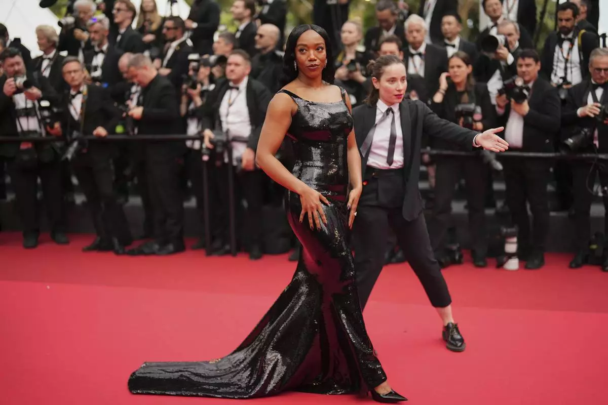 Naomi Ackie poses for photographers upon arrival at the premiere of the film 'Nouvelle Vague' at the 78th international film festival, Cannes, southern France, Saturday, May 17, 2025. (Photo by Lewis Joly/Invision/AP)