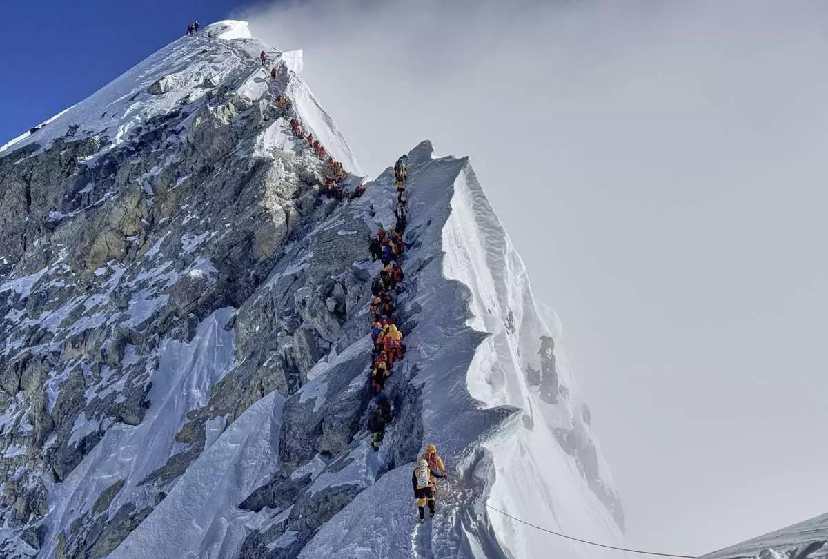 Mountaineers form a queue as they approach the summit of Mount Everest in Nepal, May 18, 2025. (AP Photo/Kunga Sherpa)
