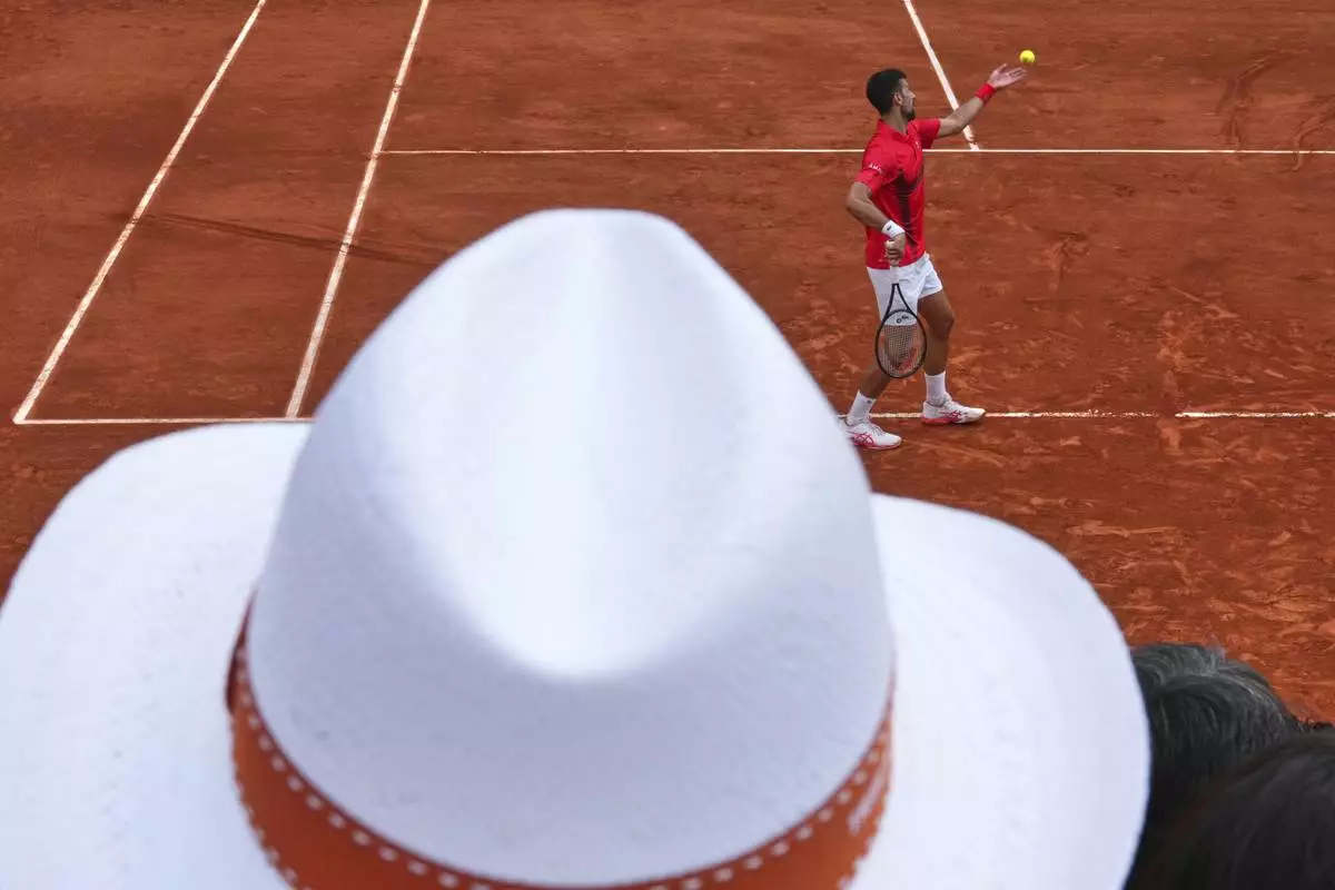 Serbia's Novak Djokovic serves against France's Corentin Moutet during their second round match of the French Tennis Open, at the Roland-Garros stadium, in Paris, Thursday, May 29, 2025. (AP Photo/Lindsey Wasson)