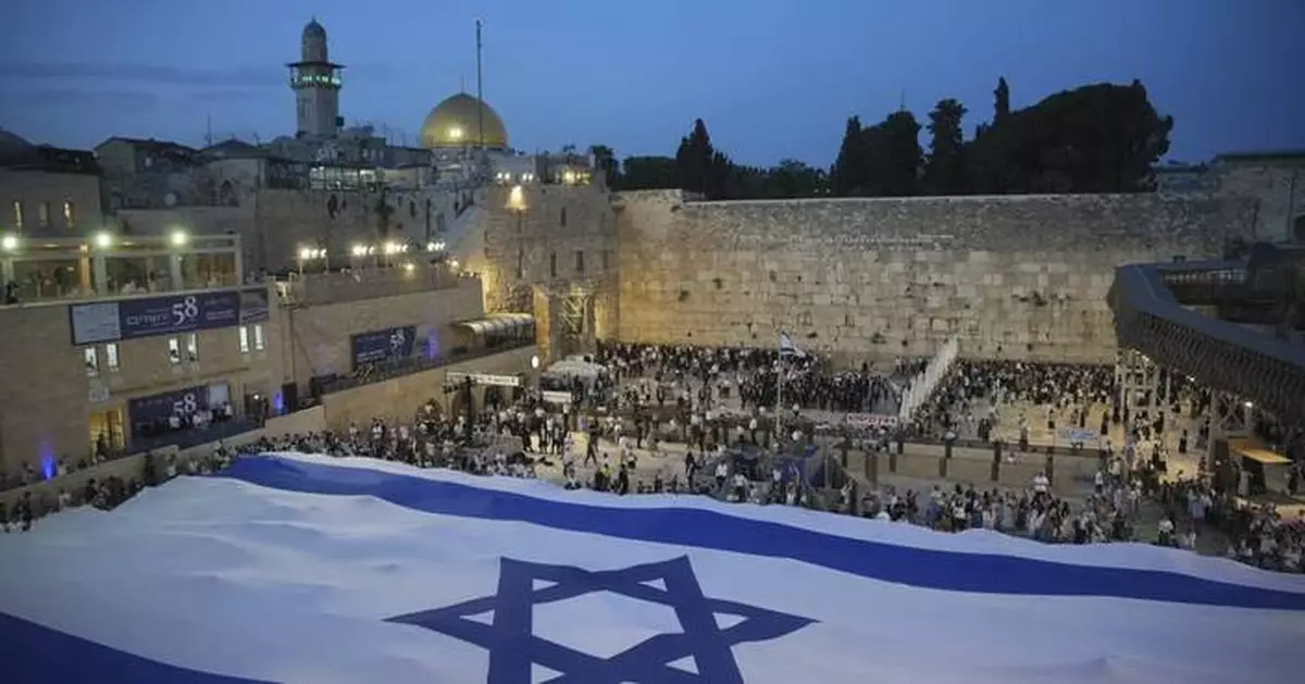 Thousands of Israeli nationalists chant 'death to Arabs' during annual procession through Jerusalem