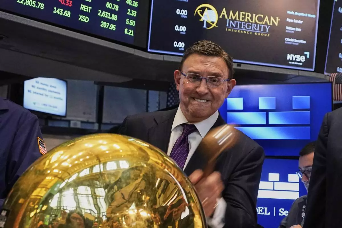 Robert Ritchie, CEO of American Integrity Insurance Company, rings a ceremonial bell as his company's IPO begins trading, on the floor of the New York Stock Exchange, Thursday, May 8, 2025. (AP Photo/Richard Drew)