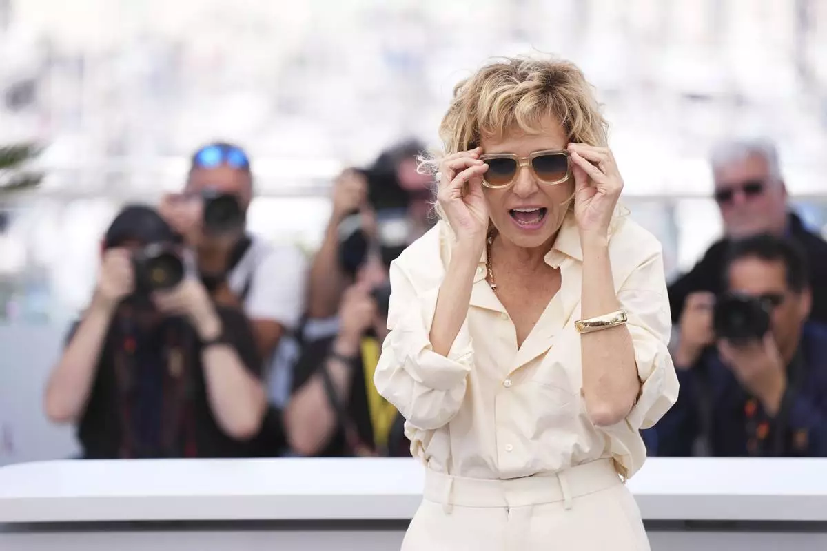 Valeria Golino poses for photographers at the photo call for the film 'Fuori' at the 78th international film festival, Cannes, southern France, Wednesday, May 21, 2025. (Photo by Lewis Joly/Invision/AP)