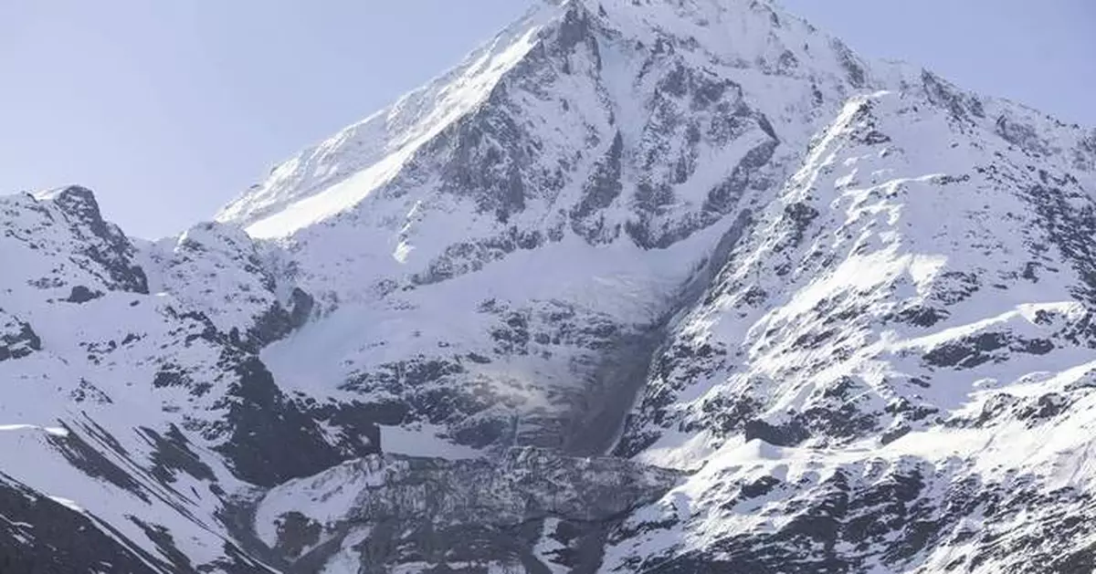 As a landslide threatens an Alpine village, Swiss authorities expand the evacuation order