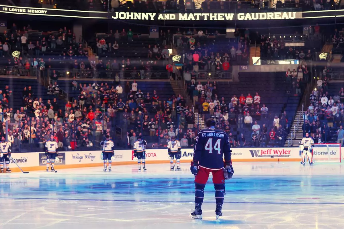 FILE - Players stand for a 13-second moment of silence in memory of Columbus Blue Jackets' Johnny Gaudreau and his brother Matthew before the start of a preseason NHL hockey game against the St. Louis Blues, Wednesday, Sept. 25, 2024, in Columbus, Ohio. (AP Photo/Jay LaPrete, File)