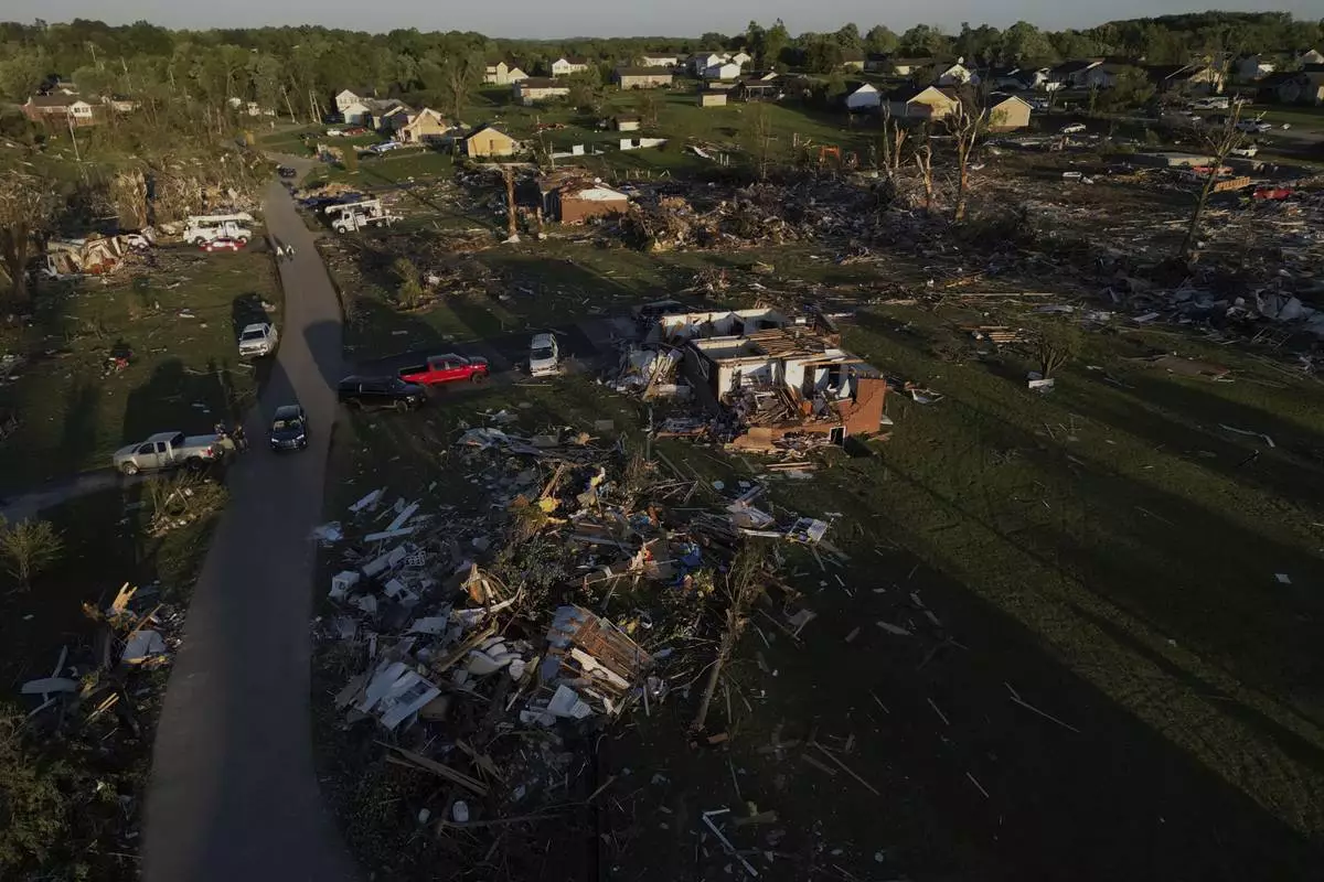 Homes are destroyed after a severe storm passed through the area, Saturday, May 17, 2025, in London, Ky. (AP Photo/Carolyn Kaster)