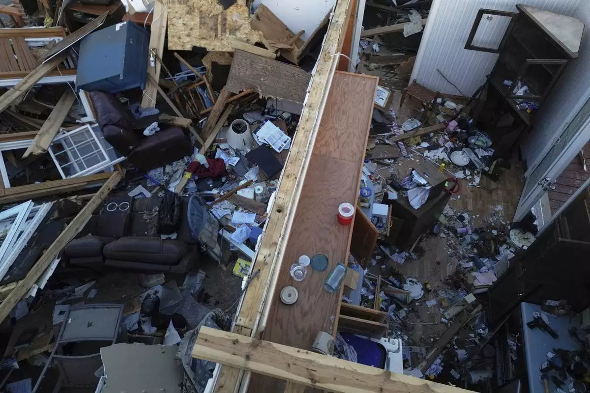 A destoryed home is seen from above after a severe storm passed through the area, Saturday, May 17, 2025, in London, Ky. (AP Photo/Carolyn Kaster)