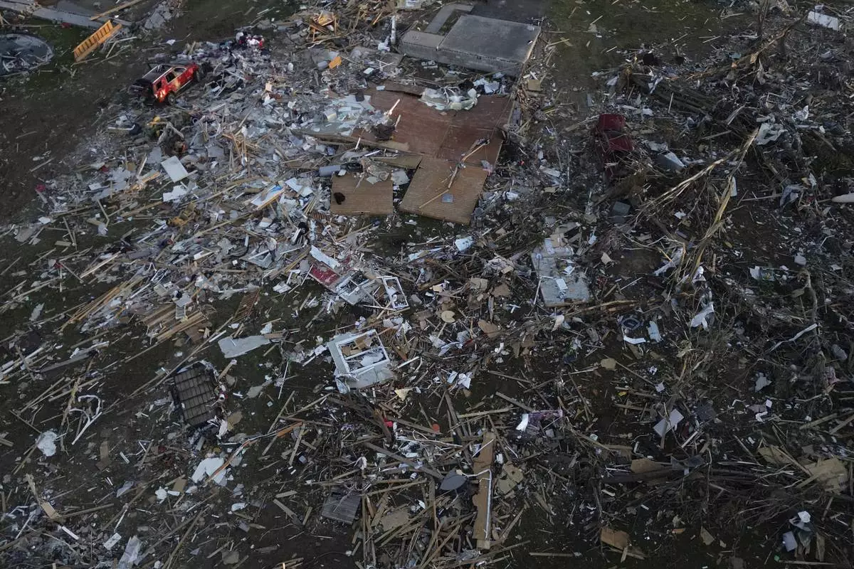 A home is destroyed after a severe storm passed through the area, Saturday, May 17, 2025, in London, Ky. (AP Photo/Carolyn Kaster)