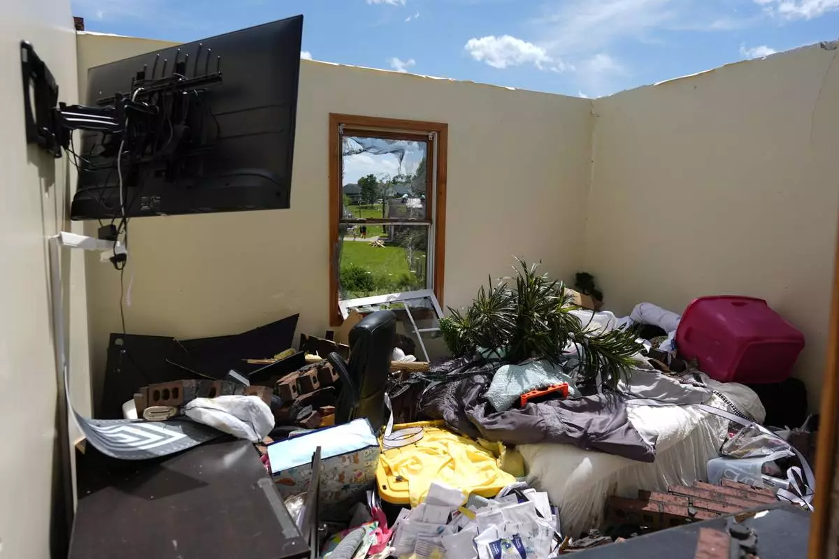A home is destroyed after a severe storm passed the area on Saturday, May 17, 2025 in London, Ky. (AP Photo/Carolyn Kaster)