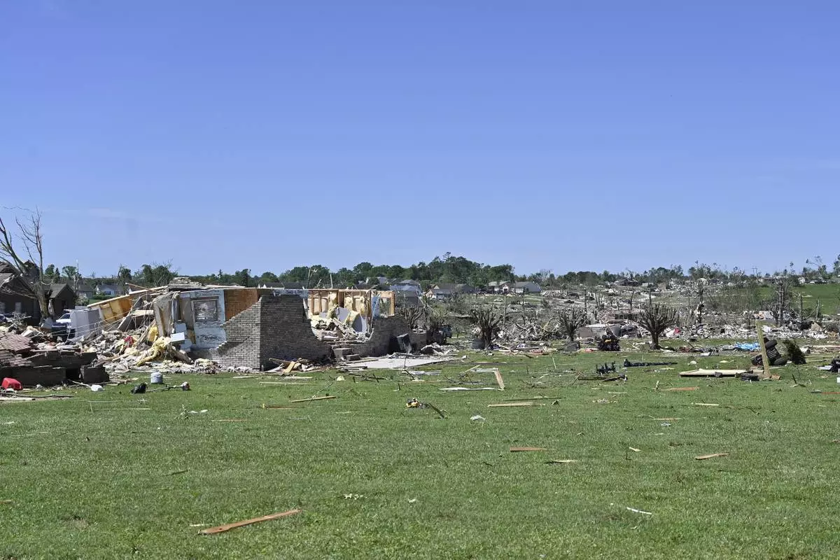 Houses lay destroyed following severe weather in London, Ky., Saturday, May 17, 2025. (AP Photo/Timothy D. Easley)