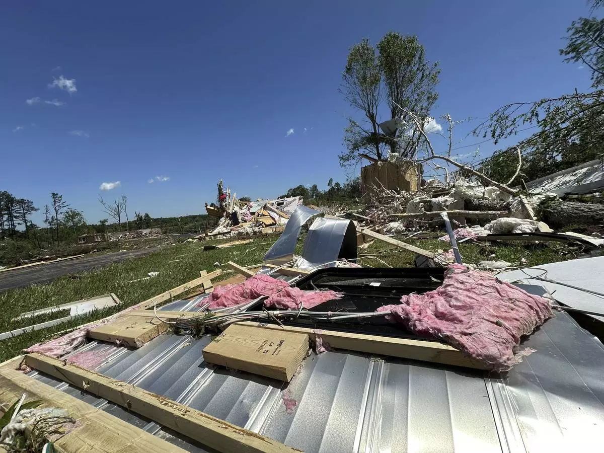 Houses lay destroyed following severe weather in London, Kentucky, Saturday, May 17, 2025. (AP Photo/Dylan Lovan)