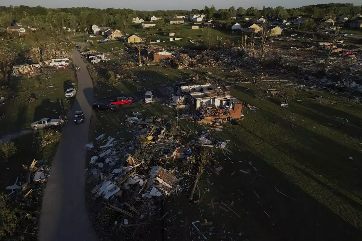 Homes are destroyed after a severe storm passed through the area, Saturday, May 17, 2025, in London, Ky. (AP Photo/Carolyn Kaster)