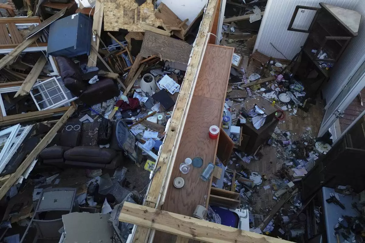 A destoryed home is seen from above after a severe storm passed through the area, Saturday, May 17, 2025, in London, Ky. (AP Photo/Carolyn Kaster)