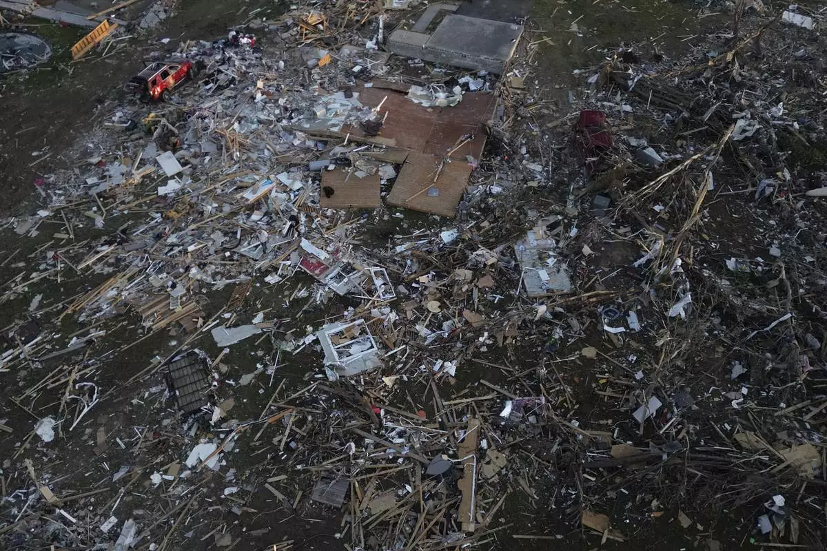 A home is destroyed after a severe storm passed through the area, Saturday, May 17, 2025, in London, Ky. (AP Photo/Carolyn Kaster)