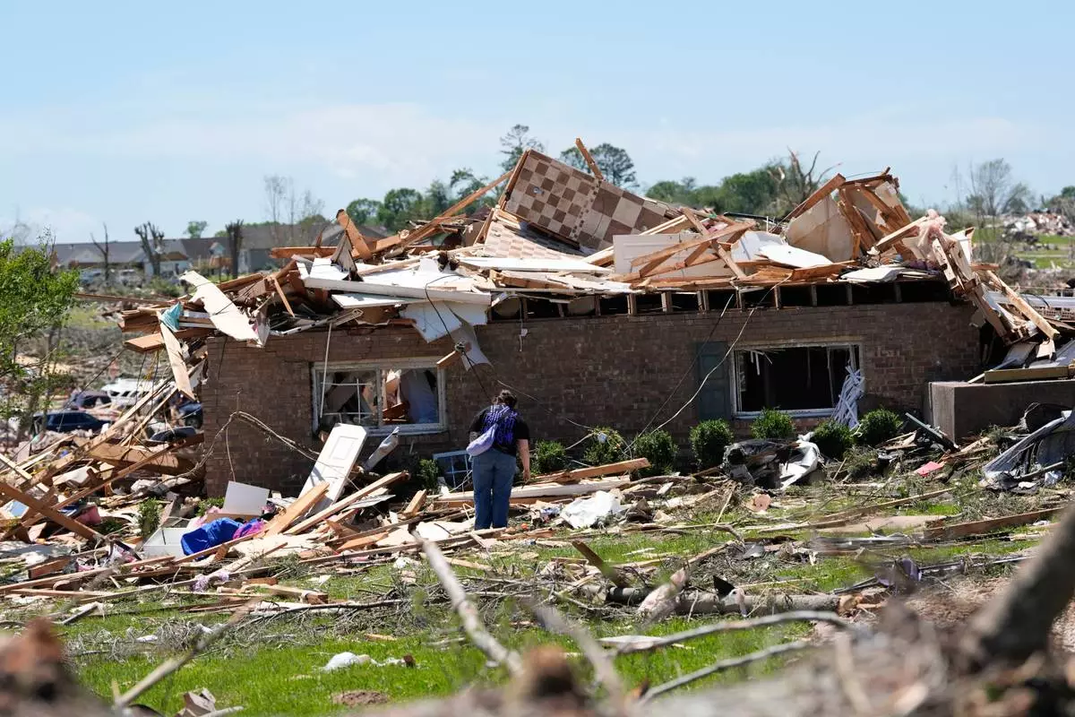 A home is destroyed after a severe storm passed the area on Saturday, May 17, 2025, in London, Ky. (AP Photo/Carolyn Kaster)