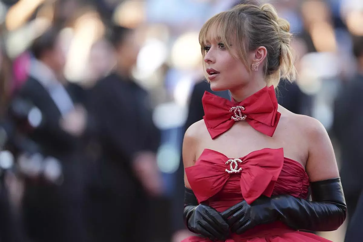Maria Braz poses for photographers upon arrival at the premiere of the film 'The Mastermind' at the 78th international film festival, Cannes, southern France, Friday, May 23, 2025. (AP Photo/Natacha Pisarenko)