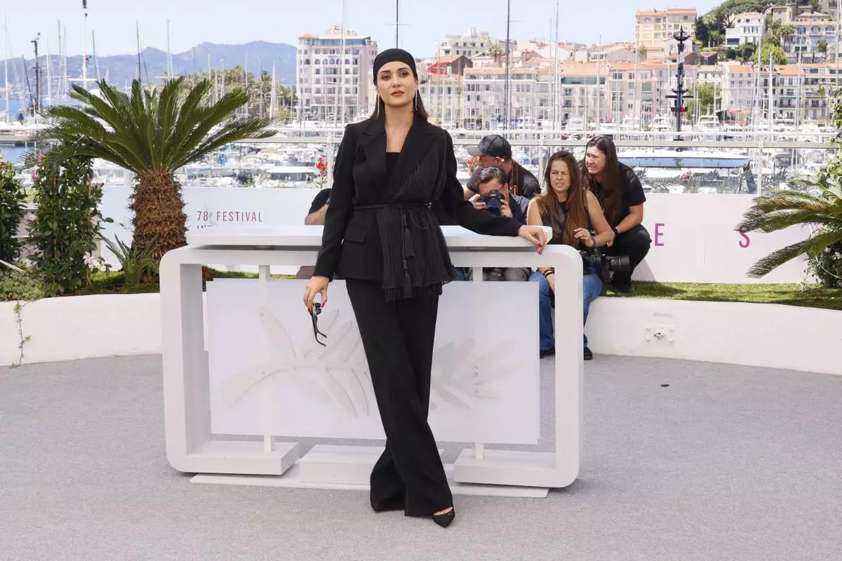 Parinaz Izadyar poses for photographers at the photo call for the film 'Woman and Child' at the 78th international film festival, Cannes, southern France, Friday, May 23, 2025. (Photo by Joel C Ryan/Invision/AP)