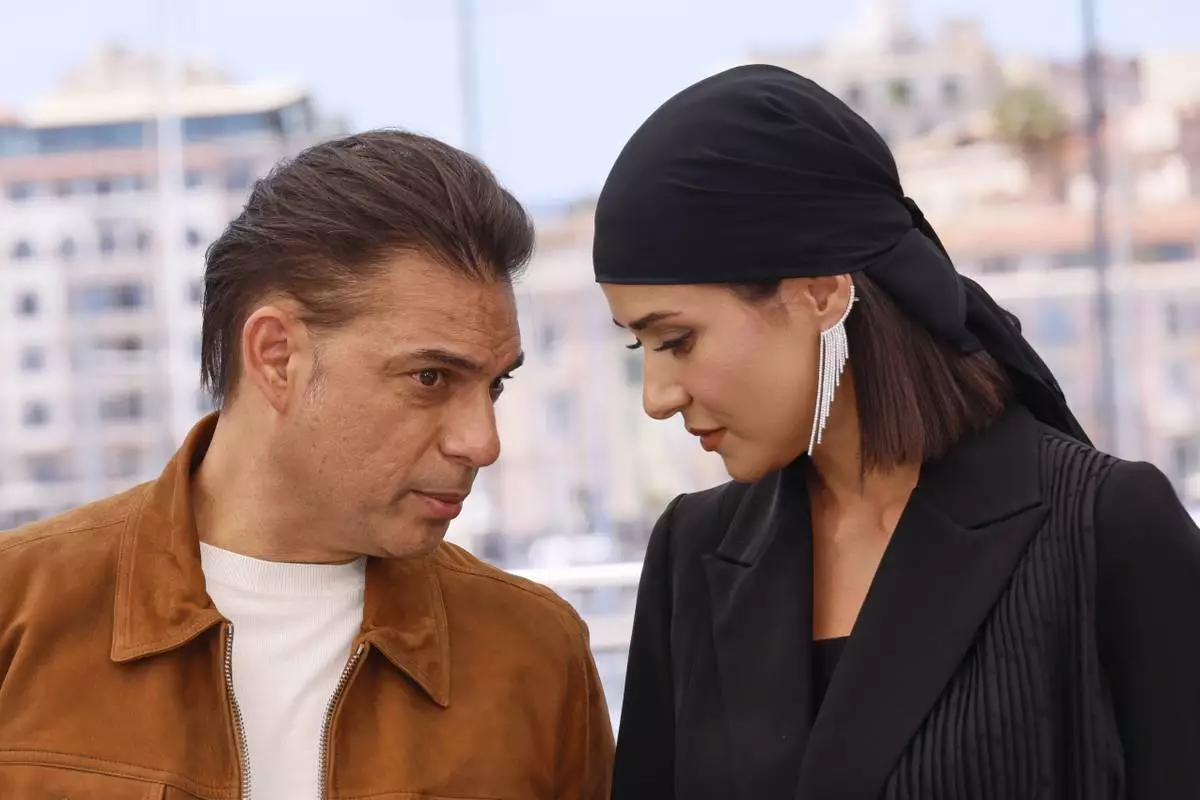 Payman Maadi, left, and Parinaz Izadyar pose for photographers at the photo call for the film 'Woman and Child' at the 78th international film festival, Cannes, southern France, Friday, May 23, 2025. (Photo by Joel C Ryan/Invision/AP)