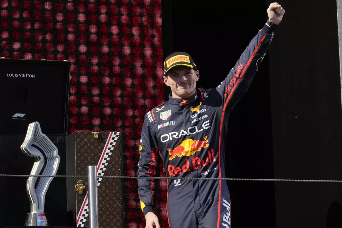 Red Bull driver Max Verstappen of the Netherlands celebrates on the podium after winning the Italian Emilia Romagna Formula One Grand Prix, at the Enzo and Dino Ferrari racetrack in Imola, Italy, Sunday, May 18, 2025. (AP Photo/Luca Bruno)