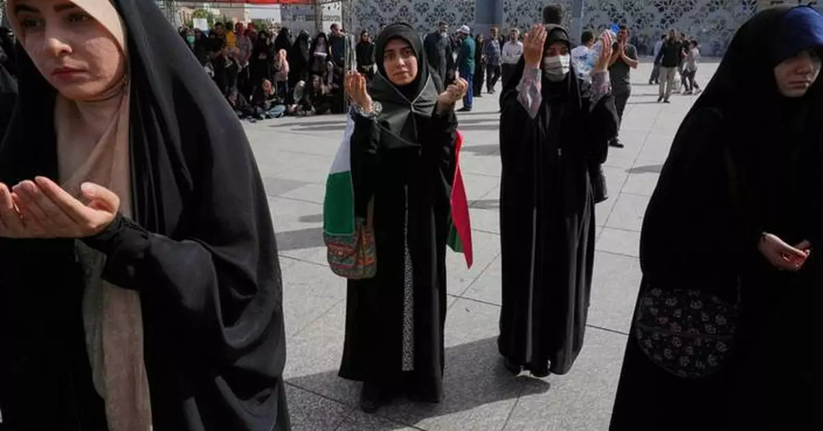 AP Analysis: Iran talks tough and launches missile all while seeking a new nuclear deal with the US