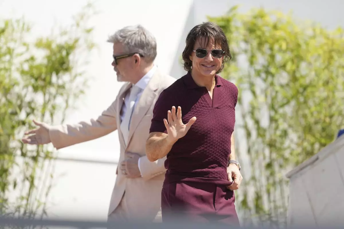 Tom Cruise arrives for the photo call for the film 'Mission: Impossible – The Final Reckoning' at the 78th international film festival, Cannes, southern France, Wednesday, May 14, 2025. (AP Photo/Natacha Pisarenko)