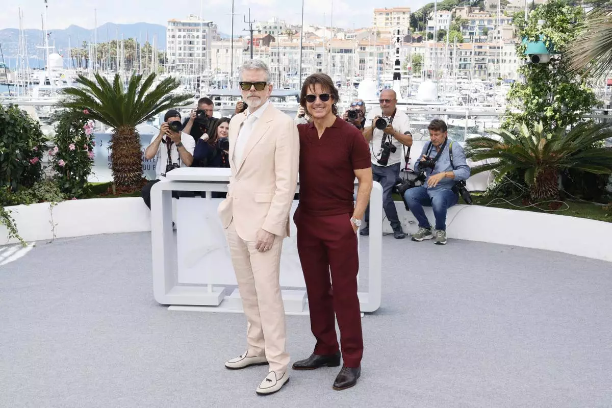 Director Christopher McQuarrie, left, and Tom Cruise pose for photographers during the photo call for the film 'Mission: Impossible – The Final Reckoning' at the 78th international film festival, Cannes, southern France, Wednesday, May 14, 2025. (Photo by Joel C Ryan/Invision/AP)