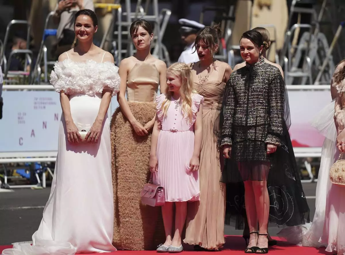 Luise Heyer, from left, Lea Drinda, Hanna Heckt, producer Maren Schmitt, and Lena Urzendowsky pose for photographers upon arrival at the premiere of the film 'Sound of Falling' at the 78th international film festival, Cannes, southern France, Wednesday, May 14, 2025. (Photo by Lewis Joly/Invision/AP)
