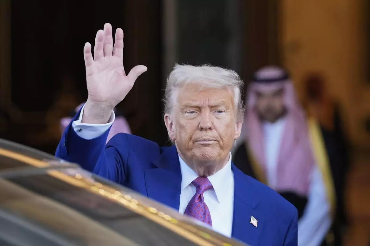 President Donald Trump waves as he leaves the Royal Palace after a signing ceremony with Saudi Crown Prince Mohammed bin Salman in Riyadh, Saudi Arabia, Tuesday, May 13, 2025. (AP Photo/Alex Brandon)