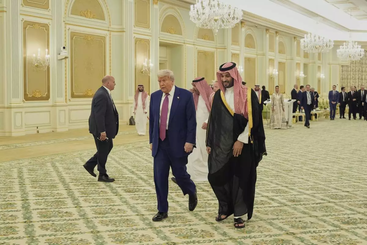President Donald Trump and Saudi Crown Prince Mohammed bin Salman walk for a signing ceremony at the Royal Palace in Riyadh, Saudi Arabia, Tuesday, May 13, 2025. (AP Photo/Alex Brandon)