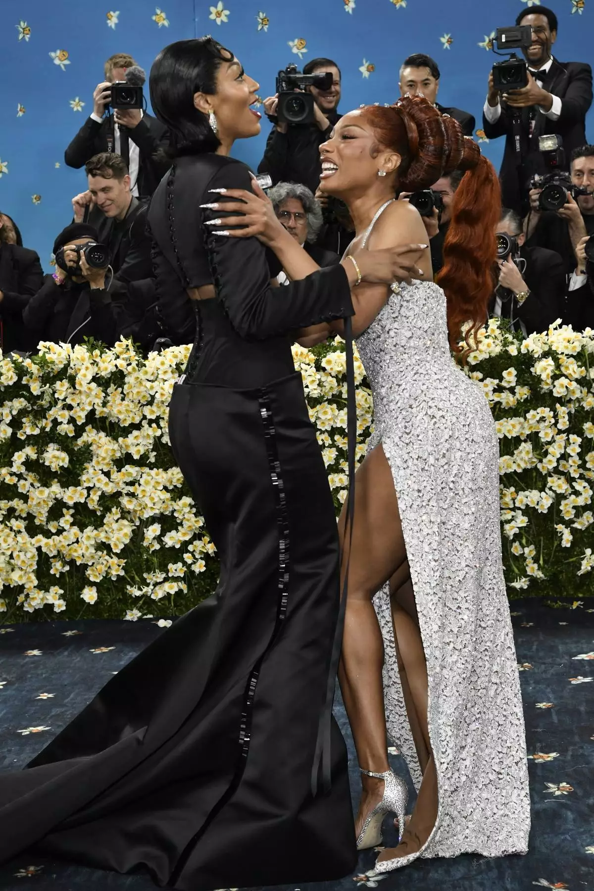 Angel Reese, left, and Megan Thee Stallion attend The Metropolitan Museum of Art's Costume Institute benefit gala celebrating the opening of the "Superfine: Tailoring Black Style" exhibition on Monday, May 5, 2025, in New York. (Photo by Evan Agostini/Invision/AP)