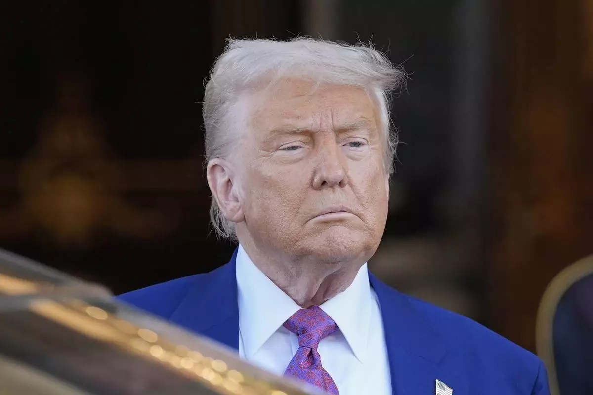 President Donald Trump looks on as he leaves the Royal Palace after a signing ceremony with Saudi Crown Prince Mohammed bin Salman in Riyadh, Saudi Arabia, Tuesday, May 13, 2025. (AP Photo/Alex Brandon)