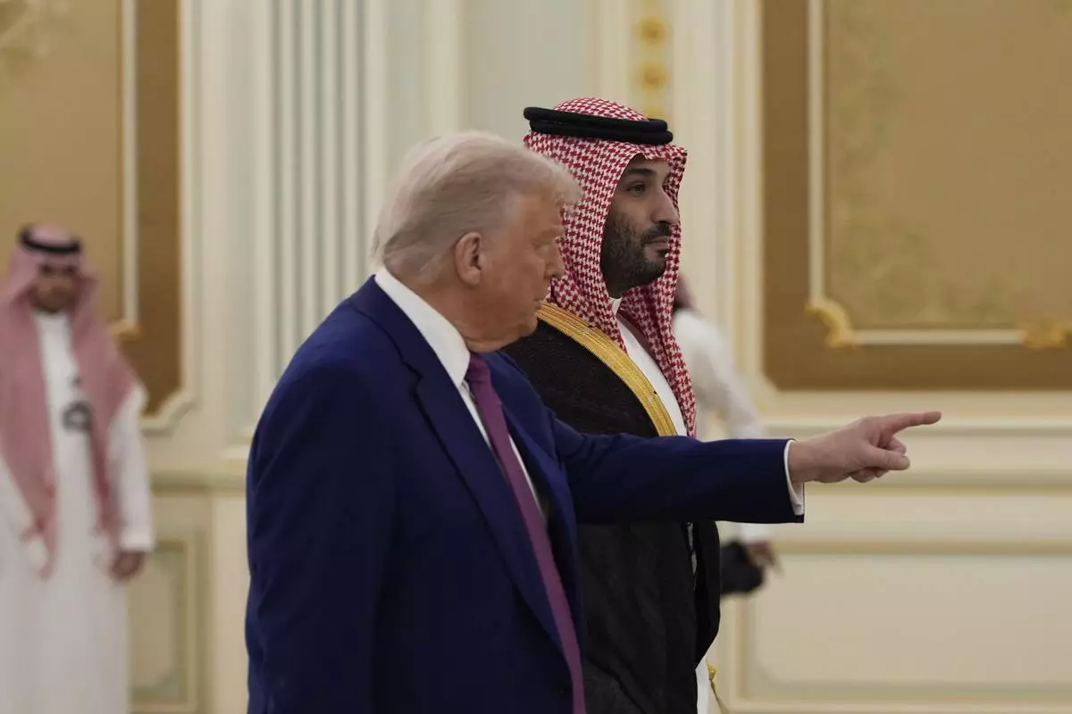 President Donald Trump and Saudi Crown Prince Mohammed bin Salman arrive for a signing ceremony at the Royal Palace in Riyadh, Saudi Arabia, Tuesday, May 13, 2025. (AP Photo/Alex Brandon)