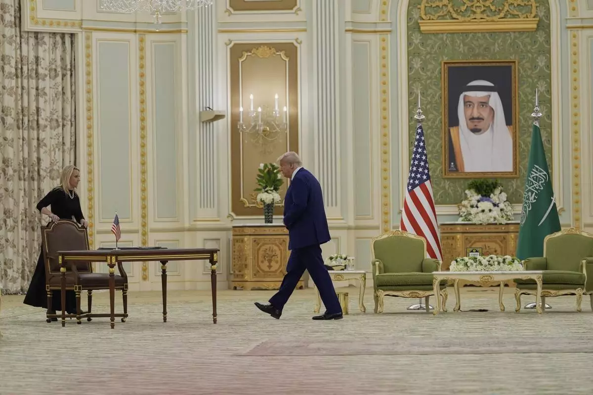 President Donald Trump arrives to sign documents during a signing ceremony at the Royal Palace in Riyadh, Saudi Arabia, Tuesday, May 13, 2025. (AP Photo/Alex Brandon)
