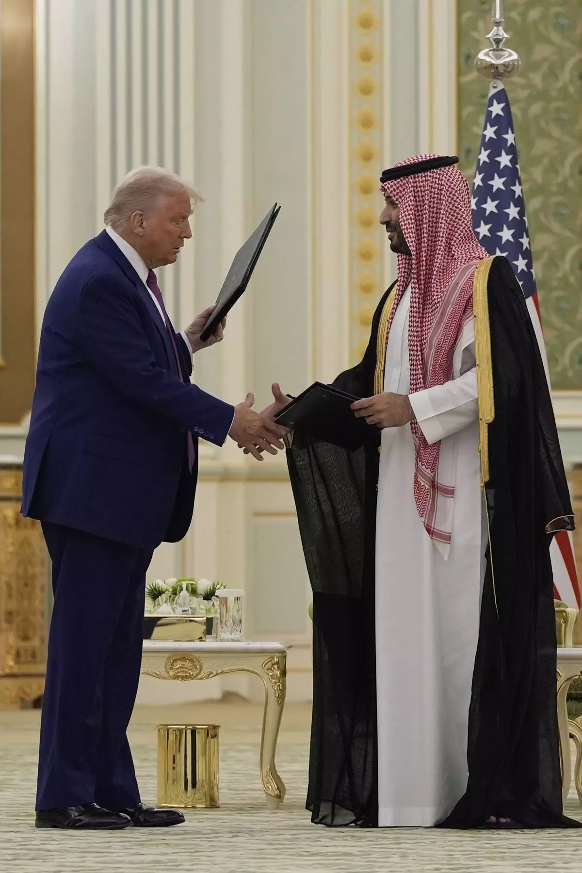 President Donald Trump and Saudi Crown Prince Mohammed bin Salman shake hands after exchanging documents during a signing ceremony at the Royal Palace in Riyadh, Saudi Arabia, Tuesday, May 13, 2025. (AP Photo/Alex Brandon)