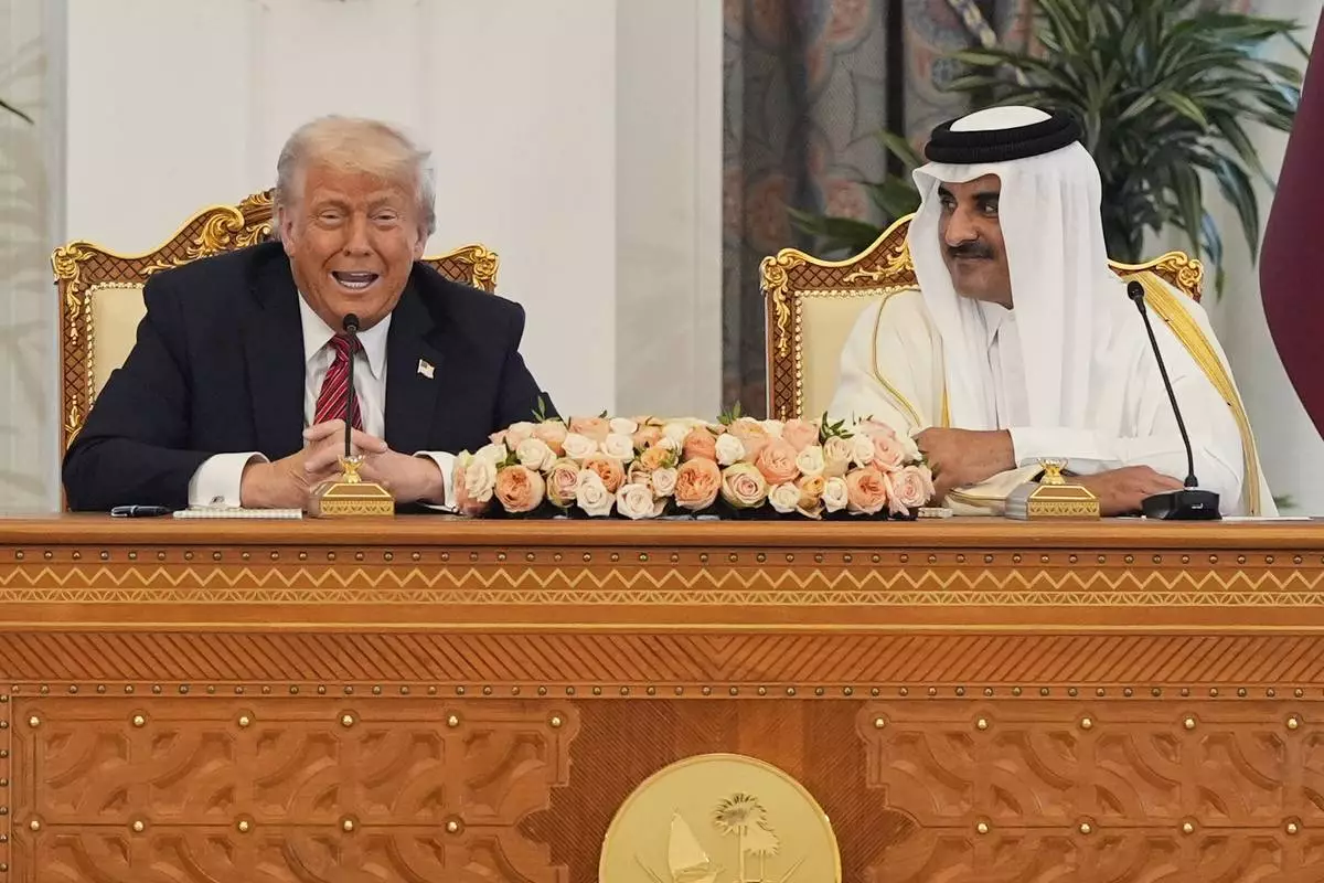 President Donald Trump speaks a signing ceremony with Qatar's Emir Sheikh Tamim bin Hamad Al Thani at the Amiri Diwan in Doha, Qatar, Wednesday, May 14, 2025. (AP Photo/Alex Brandon)