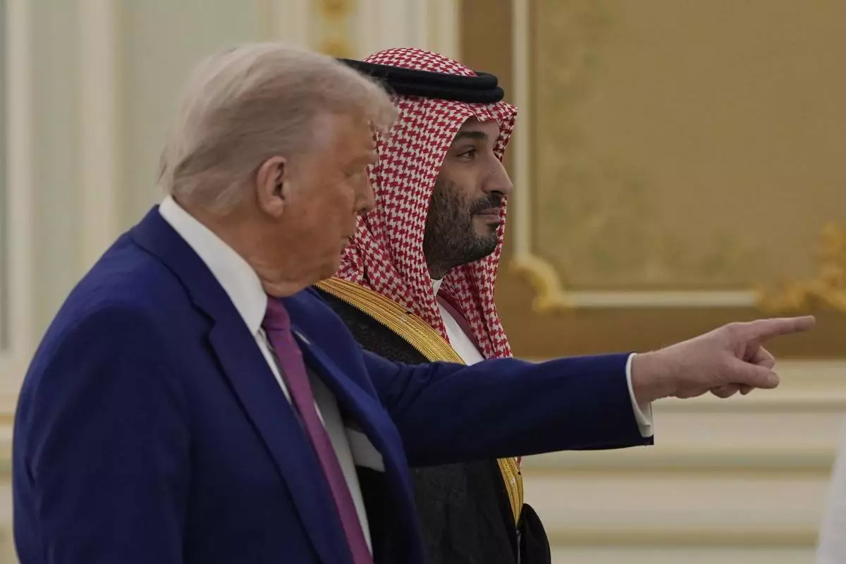 President Donald Trump and Saudi Crown Prince Mohammed bin Salman arrive for a signing ceremony at the Royal Palace in Riyadh, Saudi Arabia, Tuesday, May 13, 2025. (AP Photo/Alex Brandon)