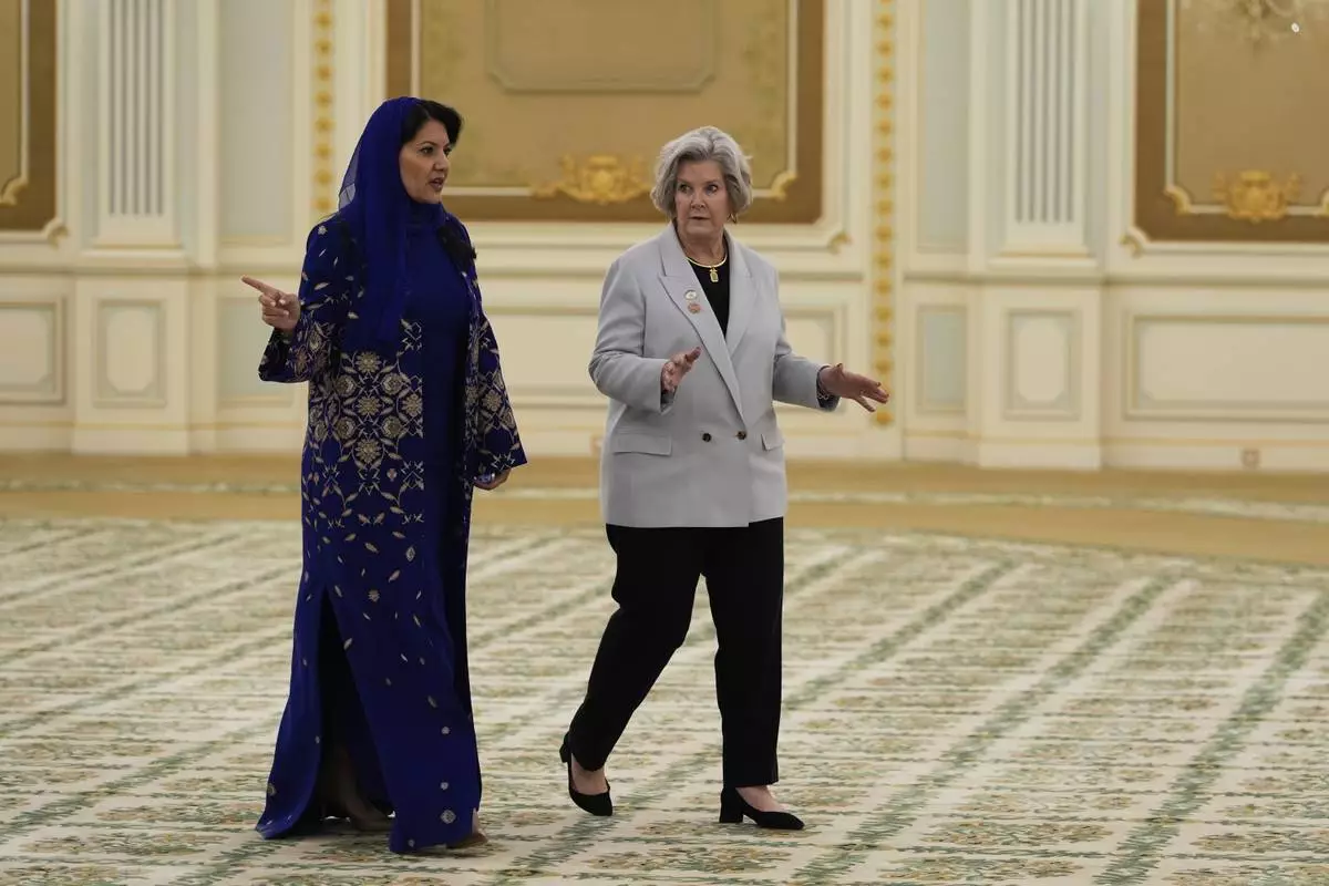 Reema bint Bandar Al Saud, Saudi ambassador to the United States, speaks with White House Chief of Staff Susie Wiles at the Royal Palace ahead of a signing ceremony in Riyadh, Saudi Arabia, Tuesday, May 13, 2025. (AP Photo/Alex Brandon)