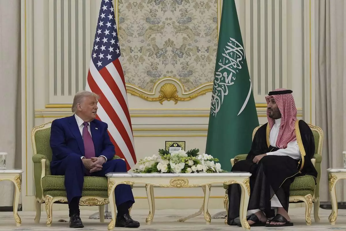 President Donald Trump and Saudi Crown Prince Mohammed bin Salman speak as they attend a signing ceremony at the Royal Palace in Riyadh, Saudi Arabia, Tuesday, May 13, 2025. (AP Photo/Alex Brandon)