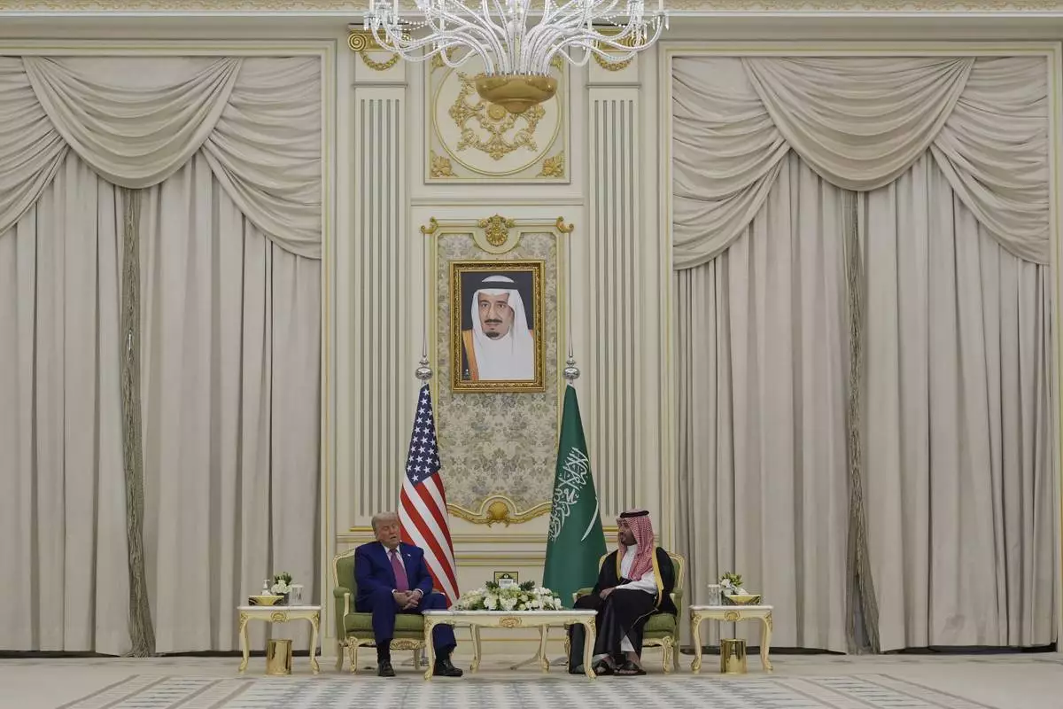 President Donald Trump and Saudi Crown Prince Mohammed bin Salman speak as they attend a signing ceremony at the Royal Palace in Riyadh, Saudi Arabia, Tuesday, May 13, 2025. (AP Photo/Alex Brandon)