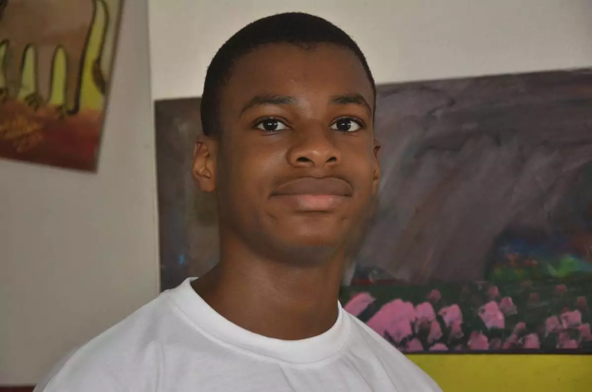 Kanyeyachukwu Tagbo Okeke, a 15 year-old autistic Nigerian, who set a Guinness World Record for the world's largest art canvas, is photograph during an interview in Abuja, Nigeria, Friday, April 18, 2025. (AP Photo/Olamikan Gbemiga)
