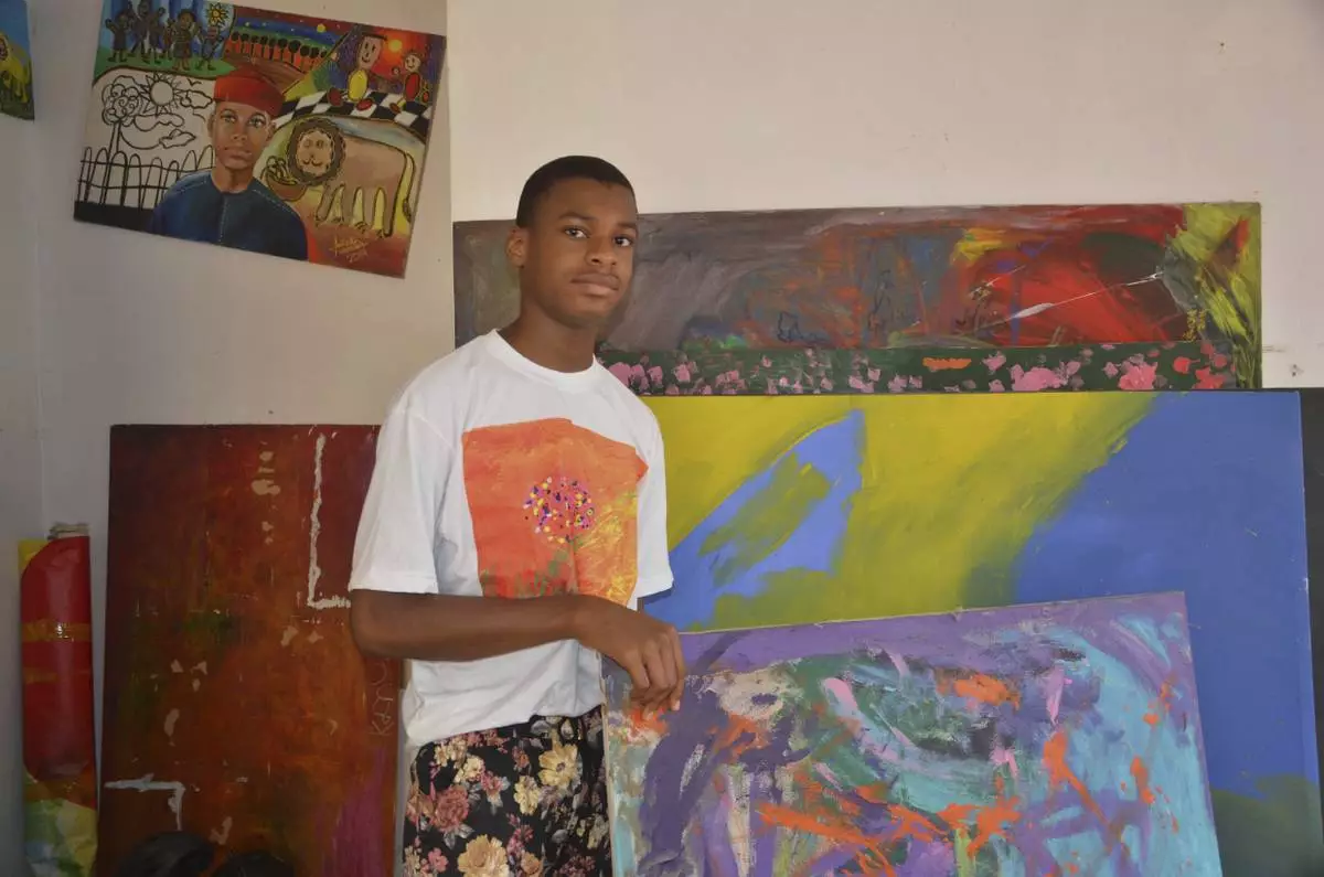 Kanyeyachukwu Tagbo Okeke, a 15 year-old autistic Nigerian, who set a Guinness World Record for the world's largest art canvas, is photograph during an interview in Abuja, Nigeria, Friday, April 18, 2025. (AP Photo/Olamikan Gbemiga)