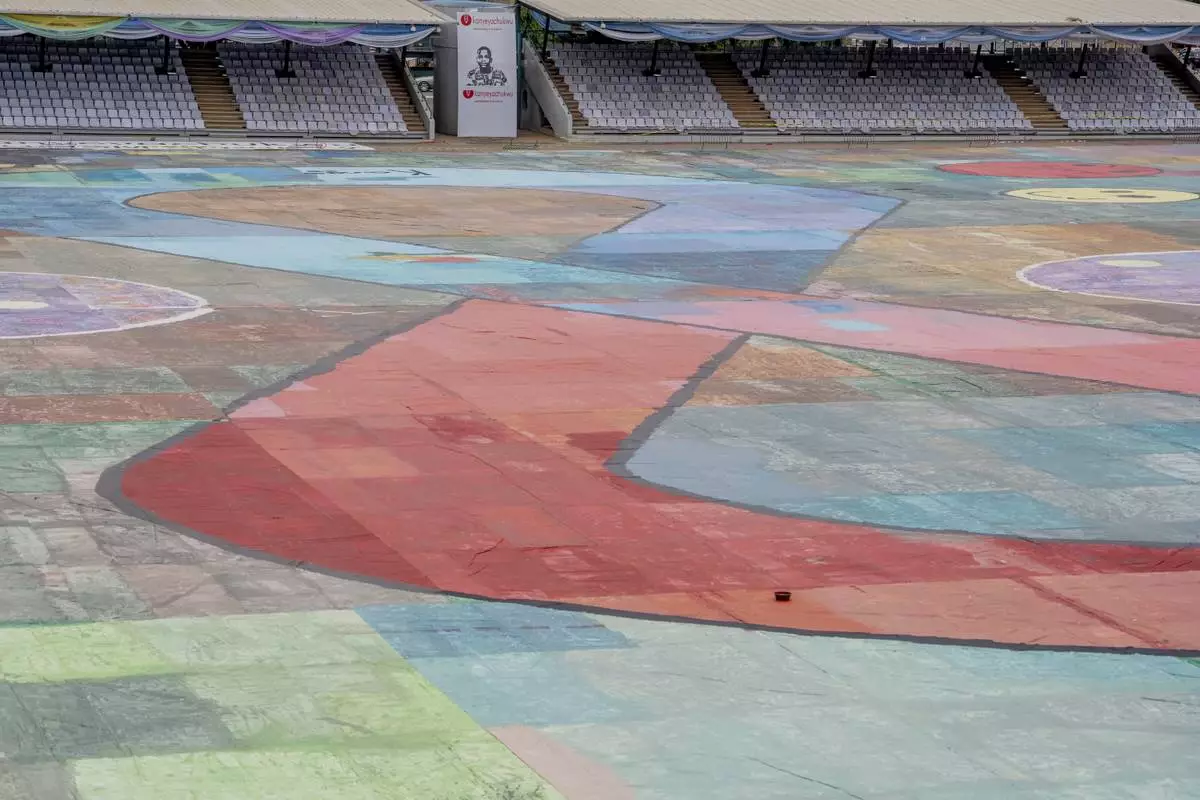An Ariel view of the canvas painting by Kanyeyachukwu Tagbo-Okeke, a 15-year-old autistic artist who won the Guinness World Record for the largest art canvas, on display at the Eagle Square on World Autism Day in Abuja, Nigeria, Wednesday, April 2, 2025. (AP Photo/David Durowaiye)