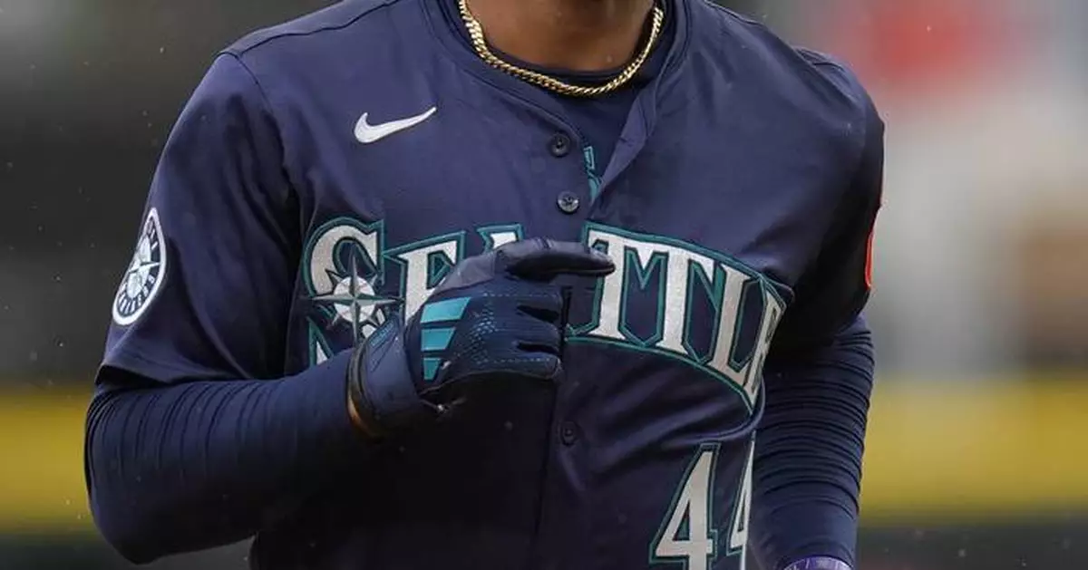 Julio Rodríguez scratched from Mariners' lineup with back tightness, day to day